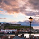 Sunset over Whitby harbour with lampost