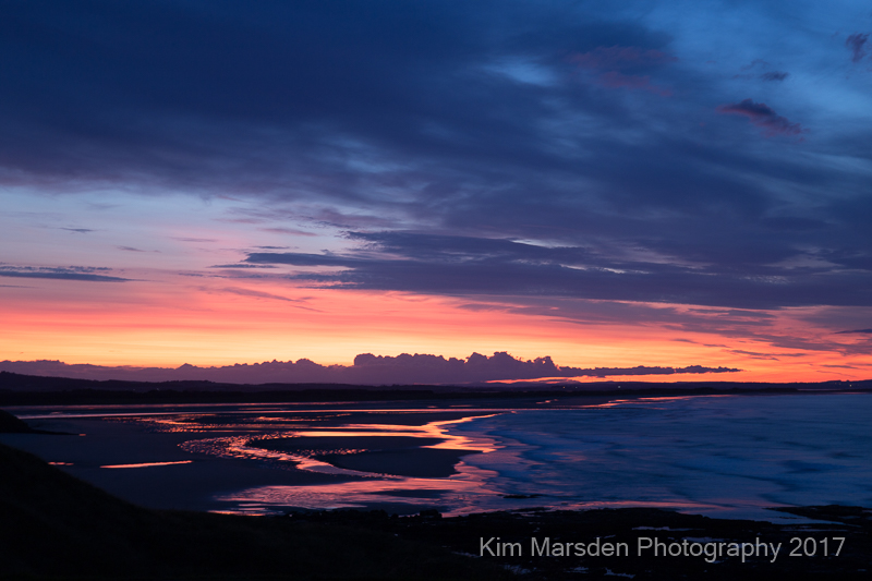 Budle Bay estuary sunset looking towards Lindisfarne