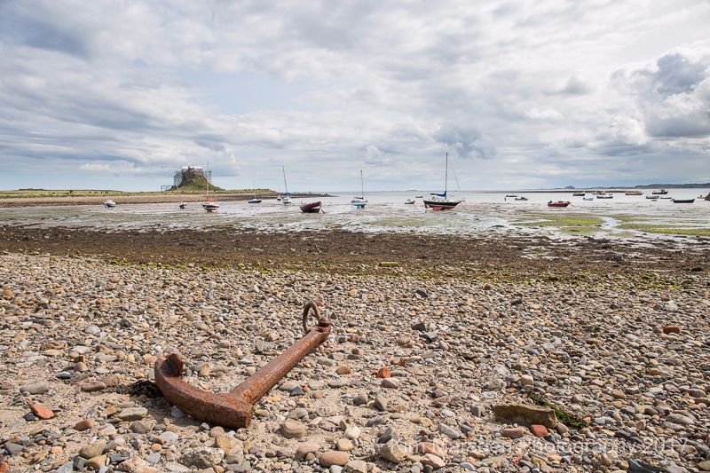Lindisfarne harbour with Bamburgh Castle in the distance