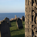 Caedmon’s Cross, St Mary's Church, overlooking graveyard & lighthouse - Whitby