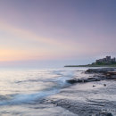 Bamburgh Castle in early dawn light