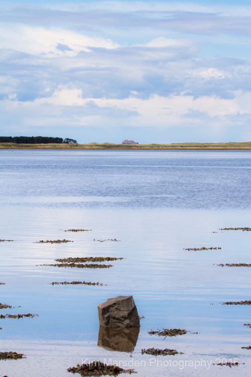 Calm waters in Budle Bay looking towards Lindisfarne