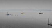 Three boats and jetty.