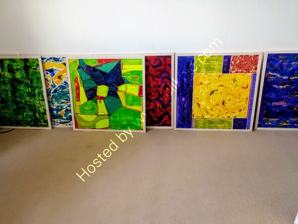Selecting work for exhibition. A range of abstracts on board 2'x2'