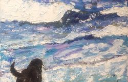 Labrador paddling in sea