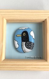 Cheeky Seagull Handpainted Stone in a 3x3 inch frame.