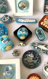 Illustrated Stones and vintage tin artworks.