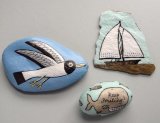 Trio of coastal themed stones.