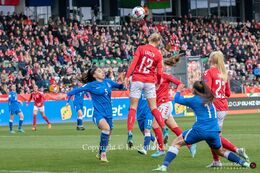 Stine Larsen (#12 Denmark) preparing for a header in the World Cup qualifier Denmark vs Azerbaijan at Energi Viborg Arena in Viborg, Denmark