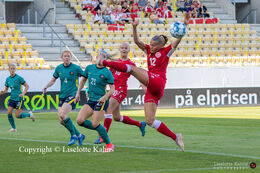 Stine Larsen (#12 Denmark) jumping for the ball in the friendly match Denmark vs. Australia at "Casa Arena" Stadium in Horsens, Denmark