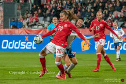 Signe Bruun (#22 Denmark) controlling the ball in the World Cup qualifier Denmark vs Bosnia and Herzegovina at Energi Viborg Arena in Viborg, Denmark