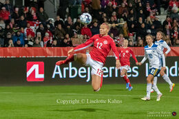 Stine Larsen (#12 Denmark) flying for the ball in the World Cup qualifier Denmark vs Bosnia and Herzegovina at Energi Viborg Arena in Viborg, Denmark