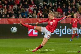 Stine Larsen (#12 Denmark) flying for the ball in the World Cup qualifier Denmark vs Bosnia and Herzegovina at Energi Viborg Arena in Viborg, Denmark