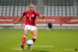 Rikke Sevecke (#4 Denmark) controlling the ball in the World Cup qualifier Denmark vs Bosnia and Herzegovina at Energi Viborg Arena in Viborg, Denmark