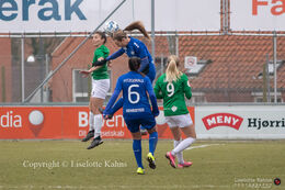 Victoria Frances Bruce (#4 Fortuna Hjorring) fighting for the ball with two HB Koge players in the "Gjensidige Kvindeliga" match between Fortuna Hjorring and FB Koge at Hjorring stadium in Hjorring, Denmark