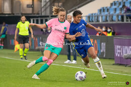 Caroline Hansen (#16 FC Barcelona) and Jess Carter (#7 Chelsea) battle for the ball in the UEFA Women's Champions League Final, Chelsea vs. FC Barcelona
