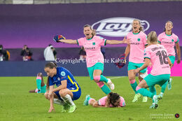 Fran Kirby (#14 Chelsea) is devastated by the defeat while the FC Barcelona players celebrate the victory in the UEFA Women's Champions League Final, Chelsea vs. FC Barcelona