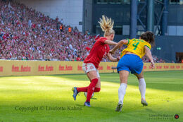 Rikke Madsen (#17 Denmark) battles for the ball in the friendly match Denmark vs Brazil at Parken Stadium, Copenhagen, Denmark