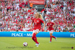 Kathrine Kühl (#15 Denmark) on the ball in the friendly match Denmark vs Brazil at Parken Stadium, Copenhagen, Denmark
