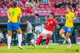 Nadia Nadim (#9 Denmark) battles for the ball in the friendly match Denmark vs Brazil at Parken Stadium, Copenhagen, Denmark