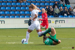 Olivia Holdt (#13 Fortuna Hjorring) passing Sofie Gron (#28 AGF) in the "Kvindeliga" match Fortuna Hjorring vs. AGF at "Bredbaand Nord Arena" in Hjorring, Denmark