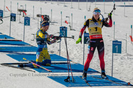 Elvira Oeberg and Marte Olsbu Roiseland at the shooting stand at the BMW IBU biathlon finals in Holmenkollen, Oslo, Norway
