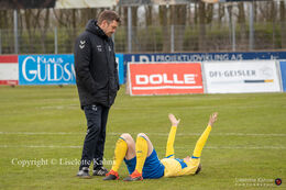 Brondby IF's coach, Per Nielsen, supporting a disappointed player in the Women's Cup Final, FC Thy-Thisted Q vs. Brondby IF at Lerpytter stadium in Thisted, Denmark