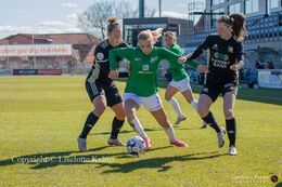 Sofie Lundgaard fighting to pass KoldingQ defenders in the "Gjensidige Kvindeliga" match between Fortuna Hjorring and KoldingQ