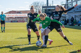 Sofie Lundgaard fighting to pass KoldingQ defenders in the "Gjensidige Kvindeliga" match between Fortuna Hjorring and KoldingQ