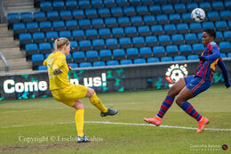 Line Johansen (#27 Fortuna Hjorring) saves a shot from Asisat Oshola (#20 FC Barcelona) in the UEFA Womens Champions League, round of 16 second-leg match between Fortuna Hjorring and FC Barcelona at Hjorring stadium in Hjorring, Denmark