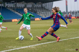 Sara Thrige Andersen (#15 Fortuna Hjorring) and Lieke Martens (#22 FC Barcelona) battle for the ball in the UEFA Womens Champions League, round of 16 second-leg match between Fortuna Hjorring and FC Barcelona at Hjorring stadium in Hjorring, Denmark