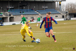 Mariona Caldentey (#9 FC Barcelona) tries to pass goalkeeper Line Johansen (#27 Fortuna Hjorring) in the UEFA Womens Champions League, round of 16 second-leg match between Fortuna Hjorring and FC Barcelona at Hjorring stadium in Hjorring, Denmark