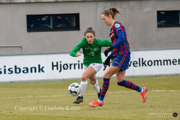 Caroline Graham Hansen (#16 FC Barcelona) and Victoria Frances Bruce (#4 Fortuna Hjorring) fight for the ball in the UEFA Womens Champions League, round of 16 second-leg match between Fortuna Hjorring and FC Barcelona at Hjorring stadium in Hjorring, Denmark