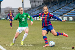 Lieke Martens (#22 FC Barcelona) tries to pass Sara Thrige Andersen (#15 Fortuna Hjorring) in the UEFA Womens Champions League, round of 16 second-leg match between Fortuna Hjorring and FC Barcelona at Hjorring stadium in Hjorring, Denmark
