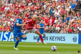 Pernille Harder (#10 Denmark) battles for the ball in the Women's Euro 2022 match Denmark vs Finland at Stadium MK, Milton Keynes, England