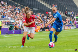 Pernille Harder (#10 Denmark) battles for the ball in the Women's Euro 2022 match Denmark vs Finland at Stadium MK, Milton Keynes, England