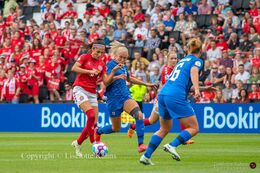 Nadia Nadim (#9 Denmark) battles for the ball in the Women's Euro 2022 match Denmark vs Finland at Stadium MK, Milton Keynes, England