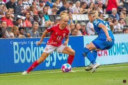 Pernille Harder (#10 Denmark) battles for the ball in the Women's Euro 2022 match Denmark vs Finland at Stadium MK, Milton Keynes, England