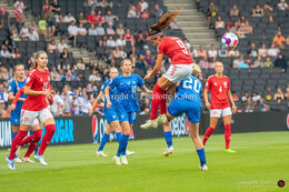 Nadia Nadim (#9 Denmark) battles for the ball in the Women's Euro 2022 match Denmark vs Finland at Stadium MK, Milton Keynes, England