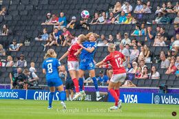 Karen Holmgaard (#6 Denmark) with a header in the Women's Euro 2022 match Denmark vs Finland at Stadium MK, Milton Keynes, England
