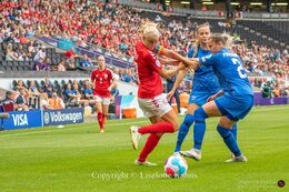 Pernille Harder (#10 Denmark) battles for the ball in the Women's Euro 2022 match Denmark vs Finland at Stadium MK, Milton Keynes, England