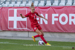 Karen Holmgaard (#6 Denmark) preparing for a shot in the World Cup qualifier Denmark vs Montenegro at Viborg Stadium, Denmark