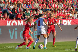 Sofie Bredgaard (#14 Denmark) battles for the ball in the World Cup qualifier Denmark vs Montenegro at Viborg Stadium, Denmark