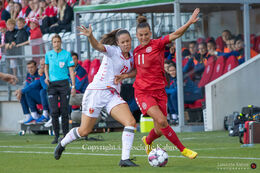 Katrine Veje (#11 Denmark) battles for the ball in the World Cup qualifier Denmark vs Montenegro at Viborg Stadium, Denmark