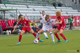 Janni Thomsen (#19 Denmark) and Stine Ballisager (#3 Denmark) battle for the ball in the World Cup qualifier Denmark vs Montenegro at Viborg Stadium, Denmark