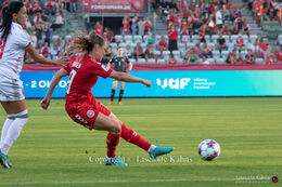 Janni Thomsen (#19 Denmark) with a shot in the World Cup qualifier Denmark vs Montenegro at Viborg Stadium, Denmark