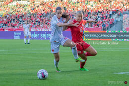 Stine Larsen (#12 Denmark) battles for the ball in the World Cup qualifier Denmark vs Montenegro at Viborg Stadium, Denmark