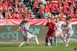 Janni Thomsen (#19 Denmark) battles for the ball in the World Cup qualifier Denmark vs Montenegro at Viborg Stadium, Denmark
