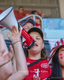 Amalie Bremer, founder of the "Fanklubforkvindelandsholdet" cheering for "Kvindelandsholdet" in the Women's Euro 2022 match Denmark vs Spain at Brentford Stadium, London, England