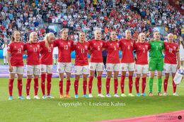 The starting XI for "Kvindelandsholdet" singing the national hymn before the Women's Euro 2022 match Denmark vs Spain at Brentford Stadium, London, England